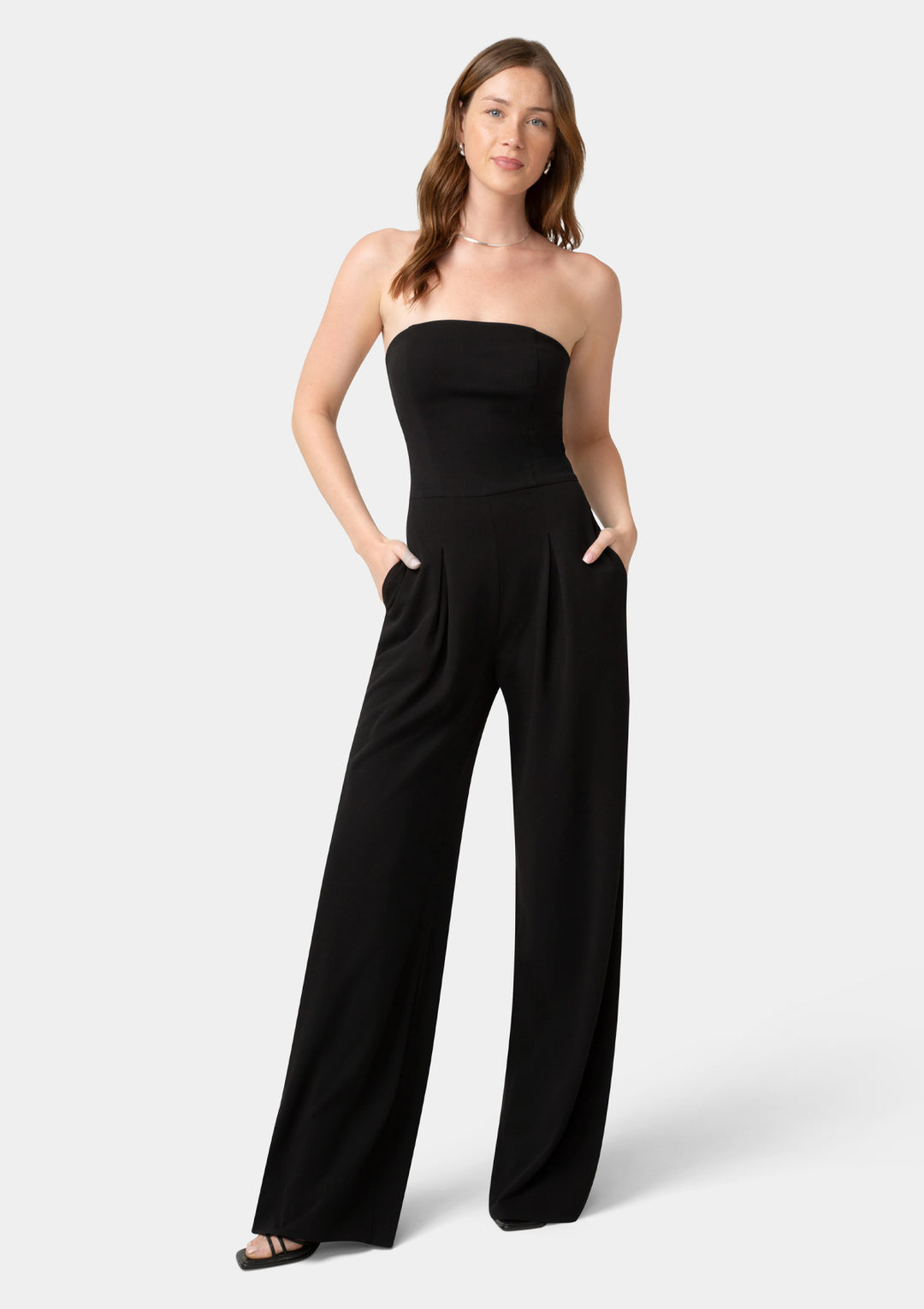 Woman wearing a black strapless jumpsuit