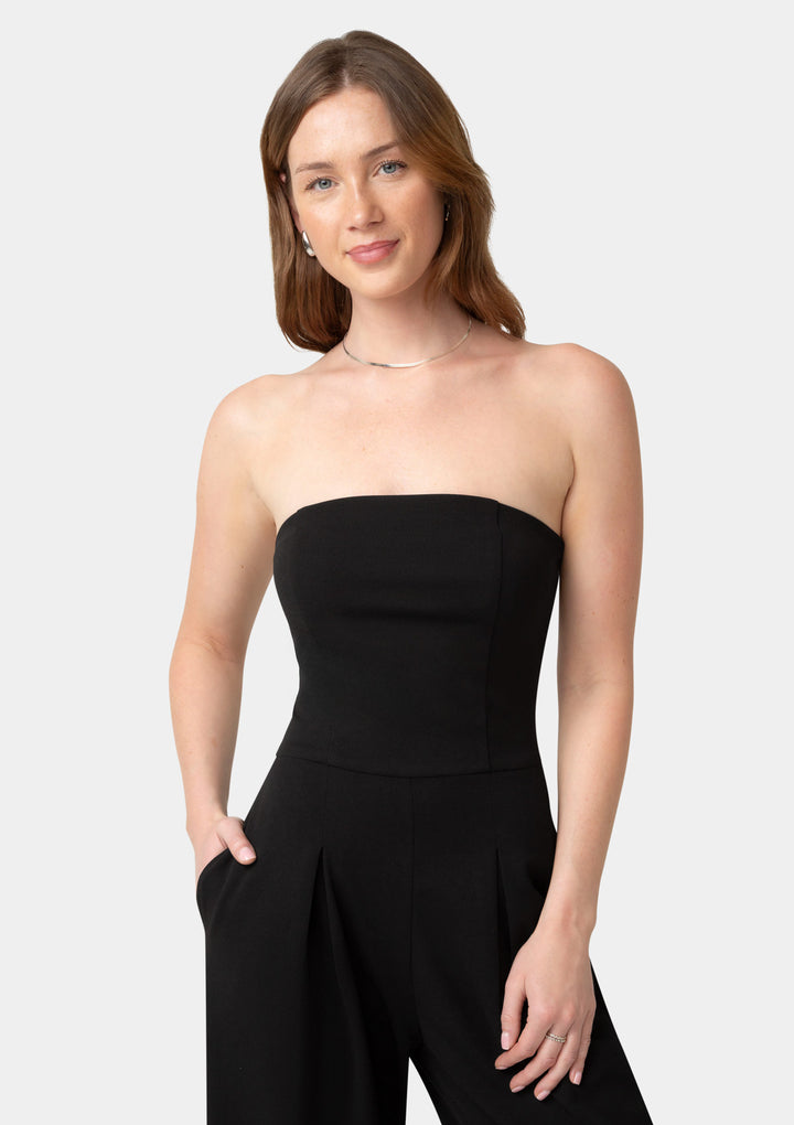 Woman wearing a black strapless jumpsuit