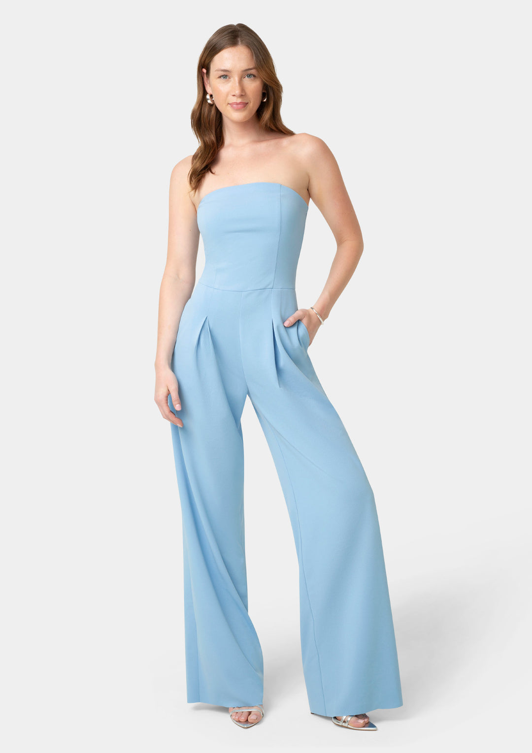 Woman wearing a light blue strapless jumpsuit