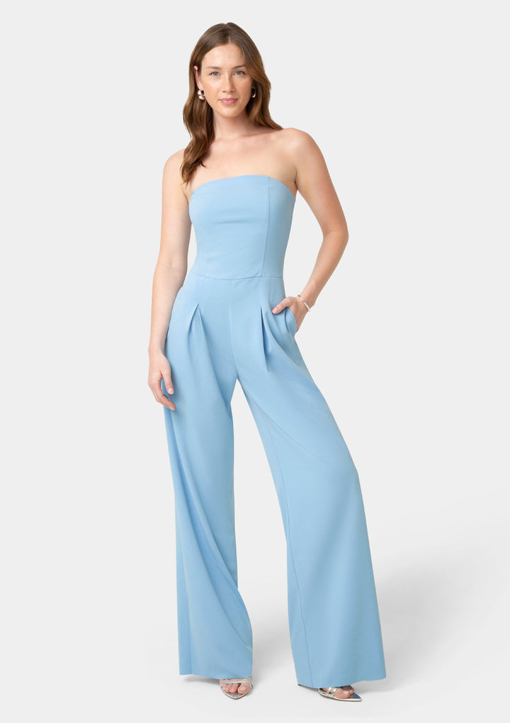 Woman wearing a light blue strapless jumpsuit