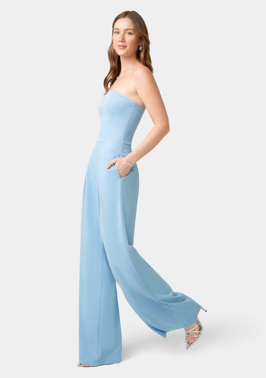 Woman wearing a light blue strapless jumpsuit